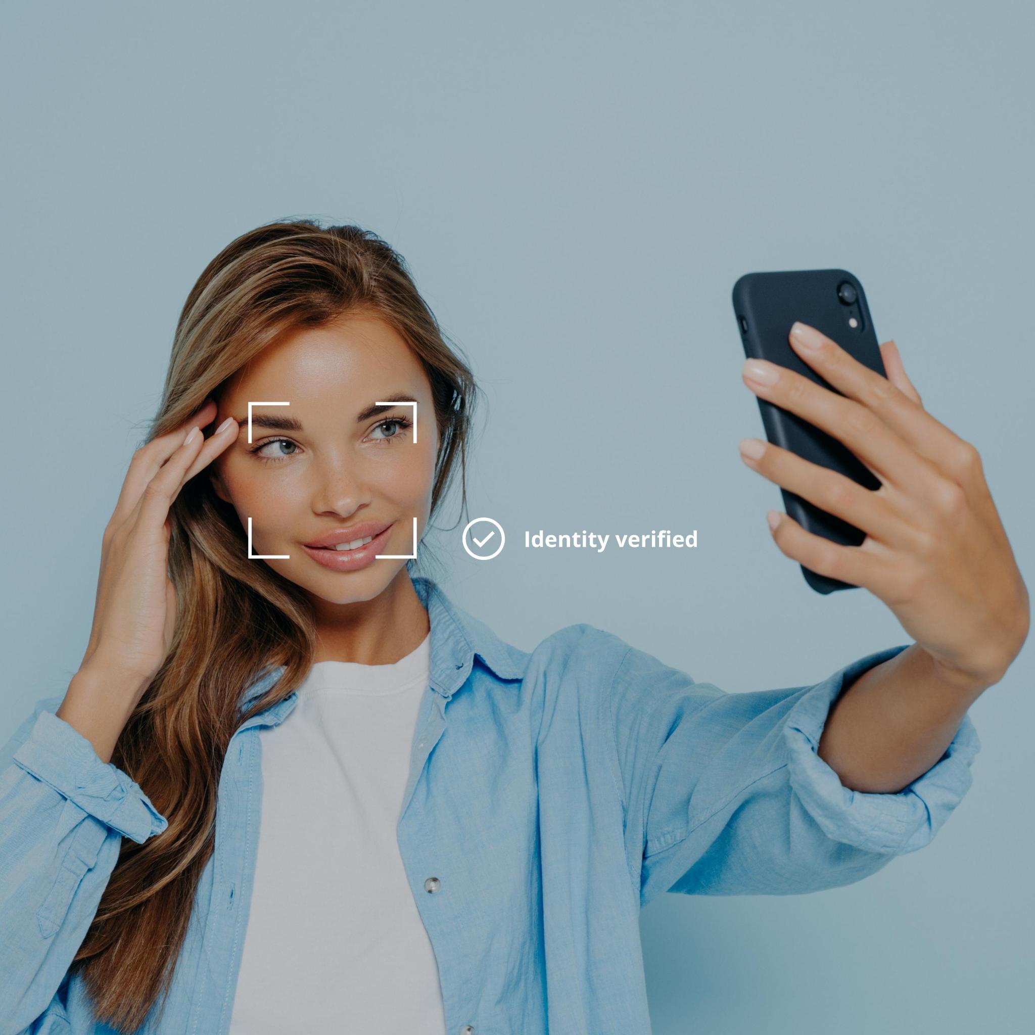 Identity verification — woman verifying identity with phone